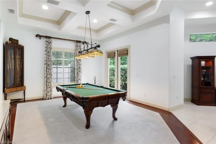 This spacious game room is a wonderful place to entertain including a wet bar!