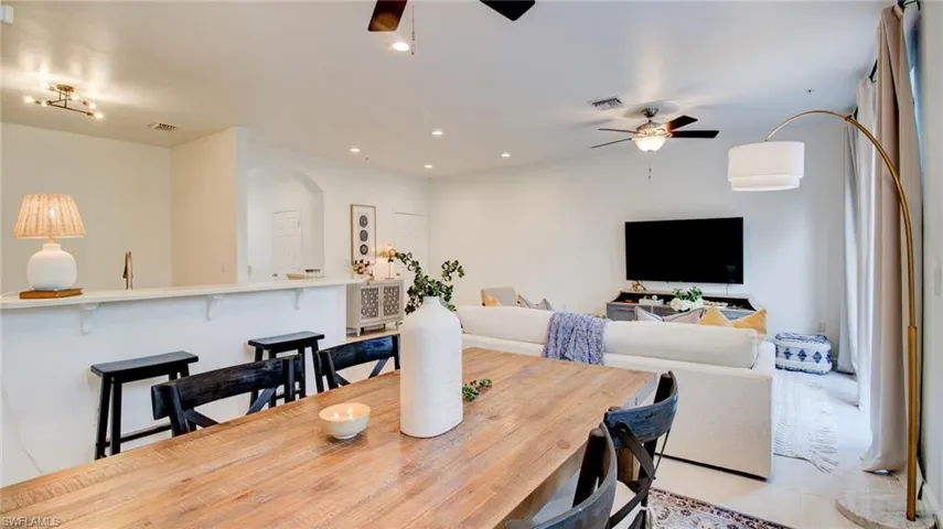 Dining room featuring recessed lighting, ceiling fan, and light tile patterned floors