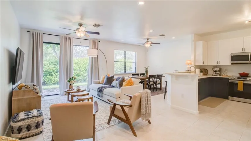 Living room with recessed lighting and a ceiling fan