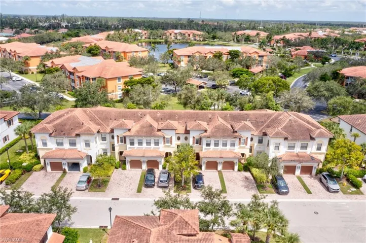 Aerial view of residential area featuring a large body of water