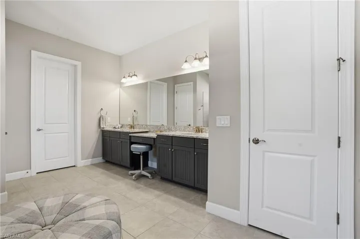 Bathroom featuring vanity and light tile patterned floors