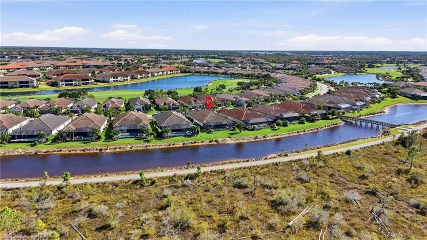 Aerial view of residential area featuring a large body of water