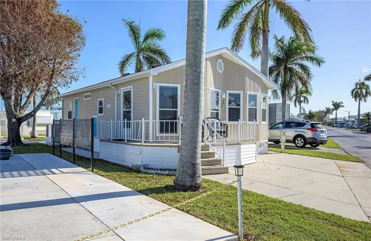 View of front of home featuring covered porch and concrete driveway