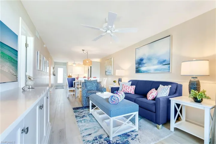 Open-concept living space with light wood-finish flooring