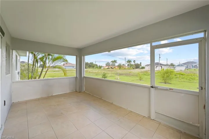 Unfurnished sunroom with plenty of natural light