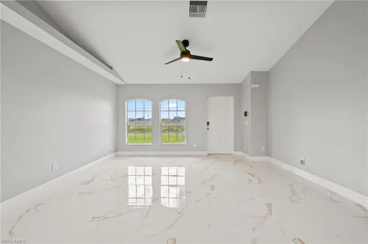 Unfurnished room featuring ceiling fan