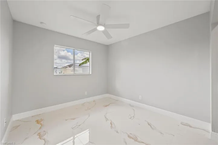 Spare room featuring ceiling fan