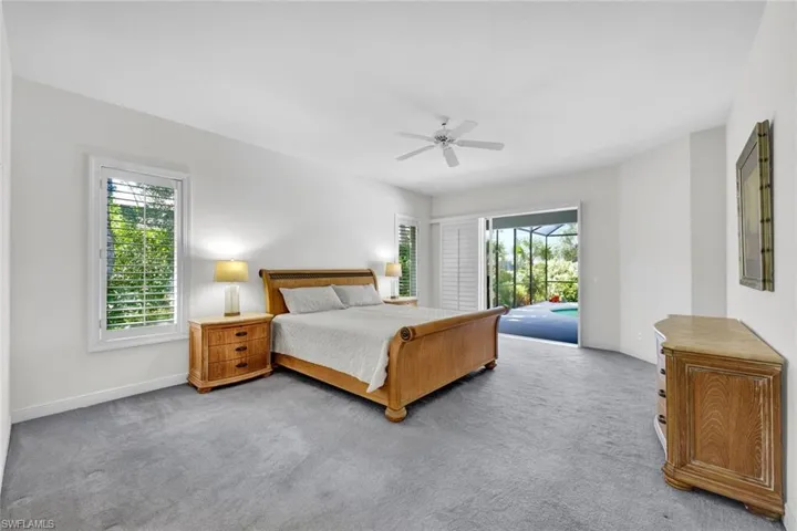 Spacious Primary Suite w. Disappearing Sliders to Lanai & 2 XL Walk-In Closets