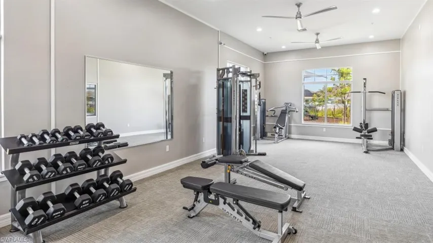 Workout room with ceiling fan, carpet flooring, baseboards, and recessed lighting