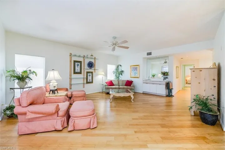 Living room featuring light hardwood / wood-style floors and ceiling fan