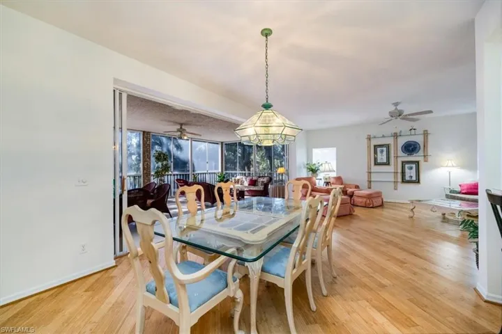 Dining space with hardwood / wood-style flooring