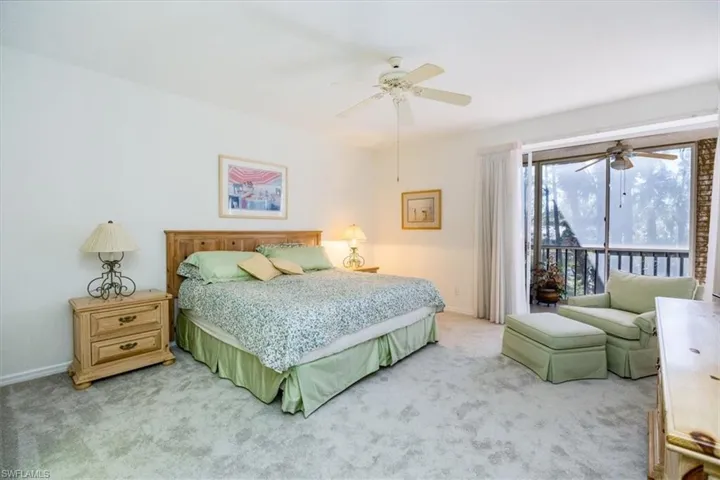 Bedroom with ceiling fan, access to exterior, and carpet floors