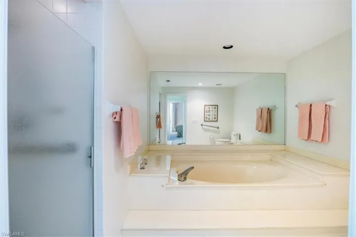 Bathroom featuring toilet and separate shower and tub
