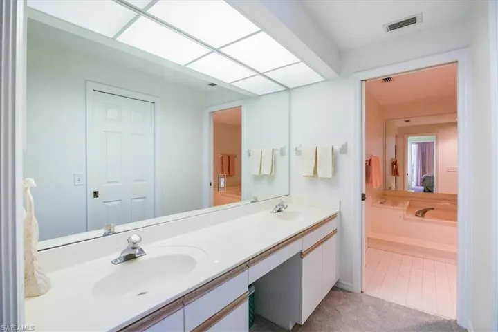 Bathroom featuring tile patterned floors and vanity