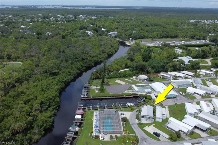 Bird's eye view of a nearby body of water and a forest