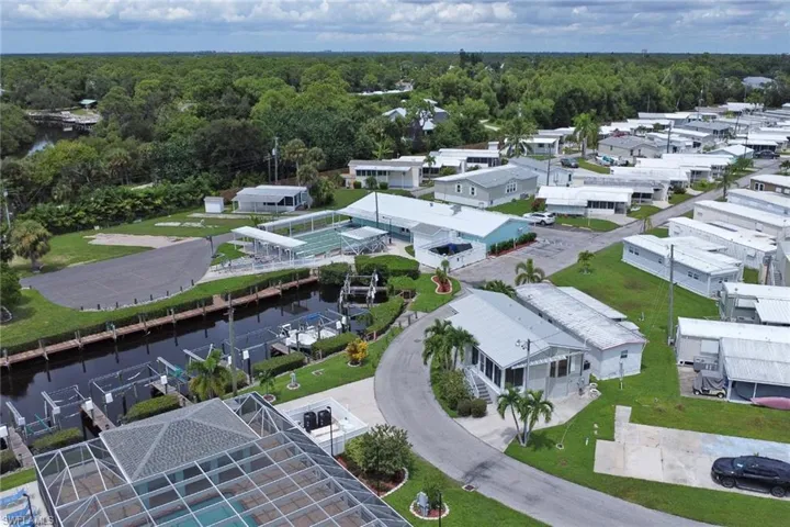 Aerial view of residential area featuring a large body of water