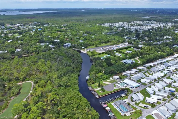 View of property location with a large body of water and nearby suburban area