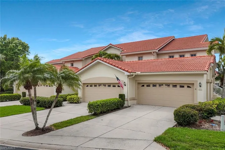Mediterranean / spanish house with stucco siding, concrete driveway, an attached garage, and a tile roof