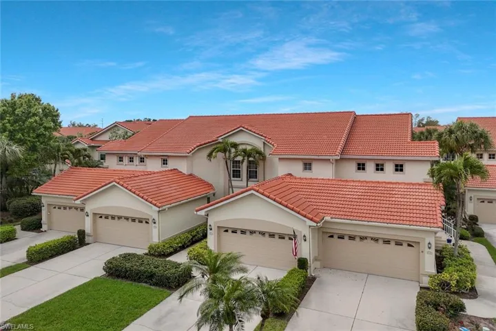 Mediterranean / spanish-style home with stucco siding, driveway, and a tiled roof