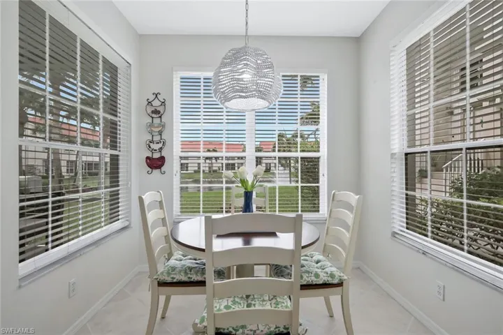 Dining space featuring light tile patterned floors