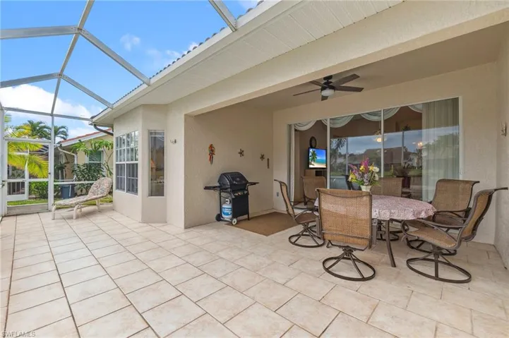 Patio with barbeque grill, dining area with lake view
