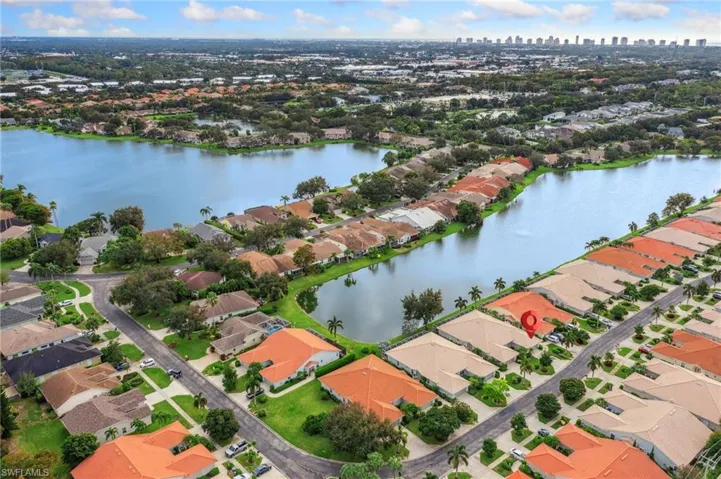 Birds eye view of property featuring a water view