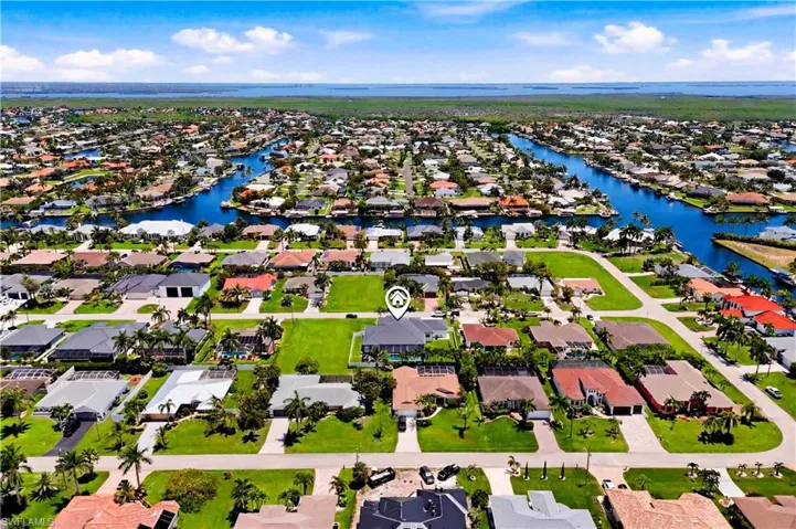 Offering oversized refined coastal luxury, this exceptional home is a rare opportunity to enjoy the very best of SWFL living!