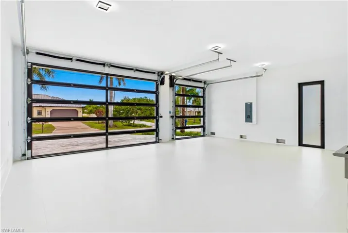 3-car garage (785 sq ft), impact-resistant Low-E glass garage doors, insulated ceiling & utility sink w/ stainless steel tub