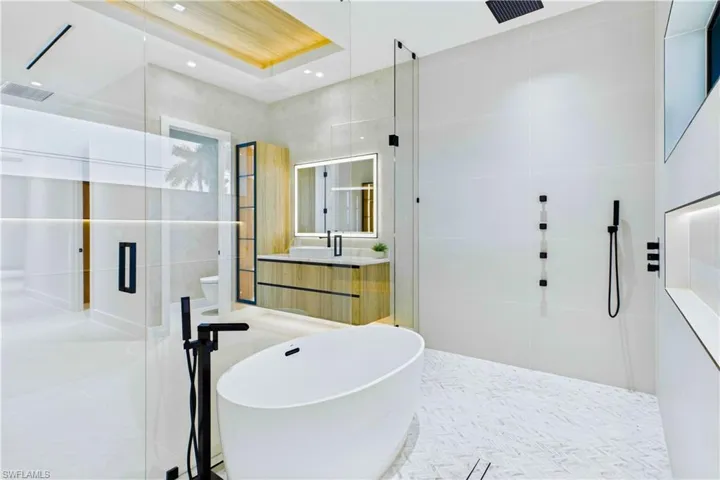 Dual rainfall showers, 4 body jets, handheld showerheads, freestanding soaking tub