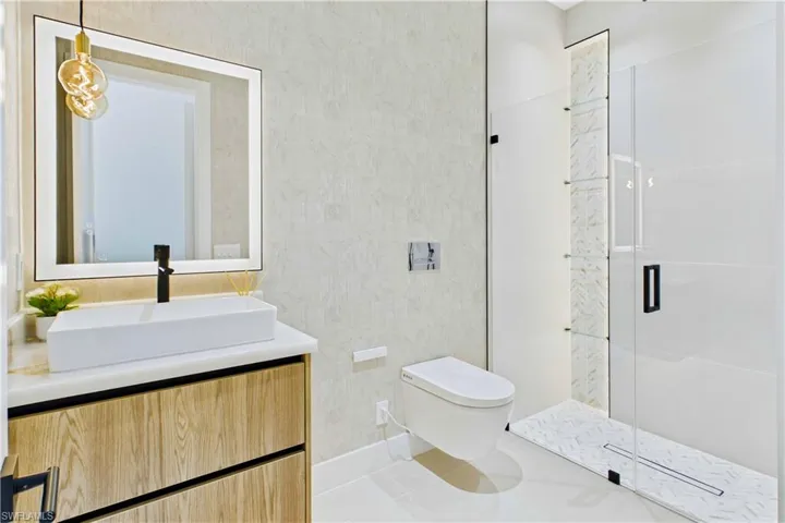 All bathrooms w/ extra-large vessel sink & WALL-MOUNTED SMART TOILETS w/ BIDET FEATURES & CONCEALED in-wall TANK SYSTEMS