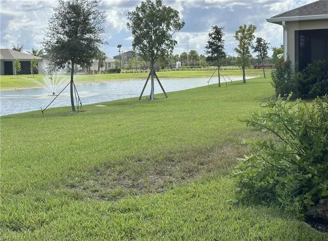 View of grassy yard featuring a water view