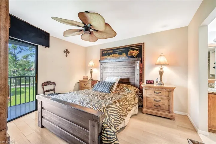 Bedroom featuring access to outside, light wood-type flooring, and ceiling fan