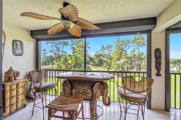 Sunroom featuring ceiling fan