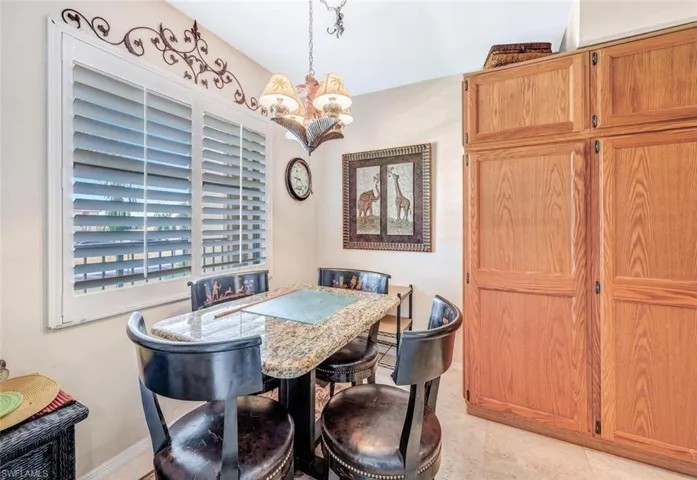 Dining area featuring an inviting chandelier and light tile patterned floors