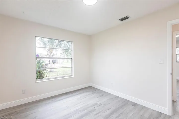 Spare room featuring light wood-style flooring