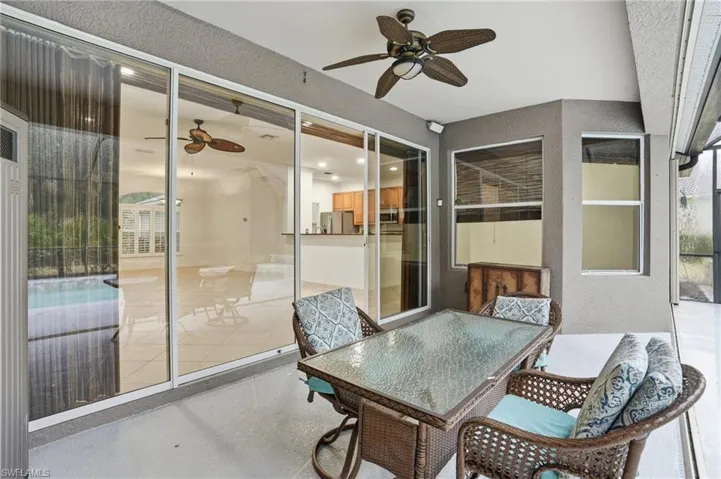 Lanai with ceiling fan and outdoor dining area