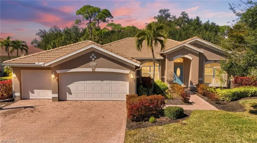 Mediterranean / spanish house with stucco siding, decorative driveway, and a tiled roof