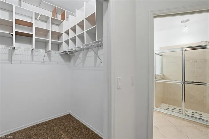 Primary bedroom walk in closet