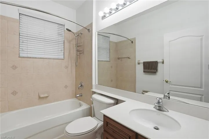 Secondary Full bath featuring vanity and bathtub / shower combination