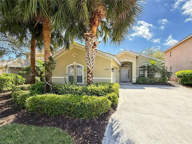 Mediterranean / spanish-style house with driveway, an attached garage, and stucco siding