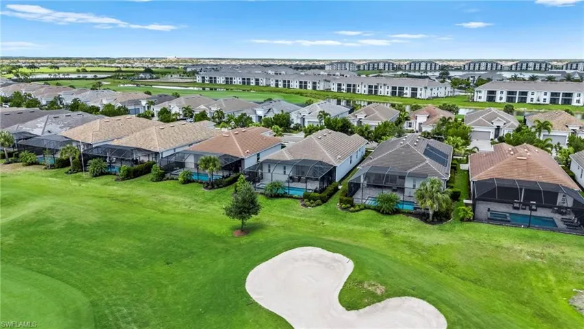 Aerial view with a water view, golf course view, and a residential view