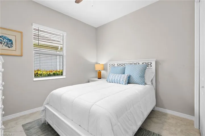 Bedroom featuring baseboards and a ceiling fan