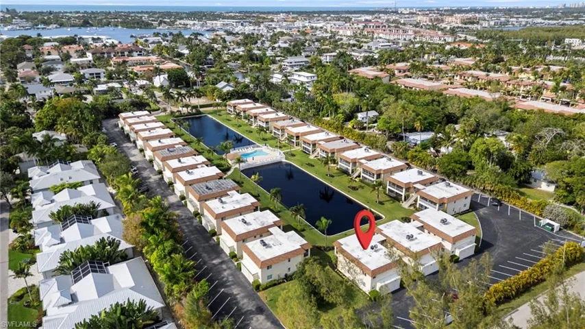 Aerial overview of property's location with a large body of water