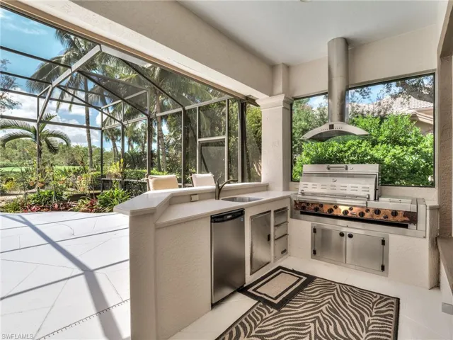 Sunroom featuring sink and a wealth of natural light