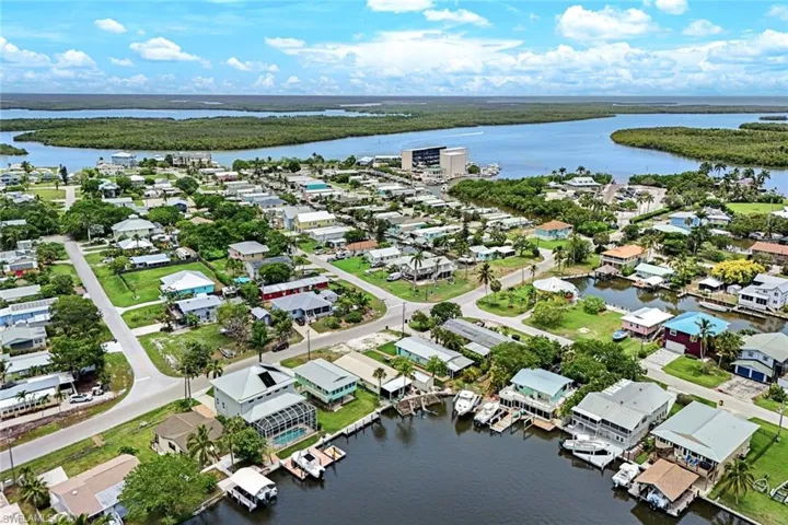 Aerial perspective of suburban area with a nearby body of water