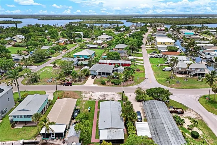 Aerial perspective of suburban area with a nearby body of water
