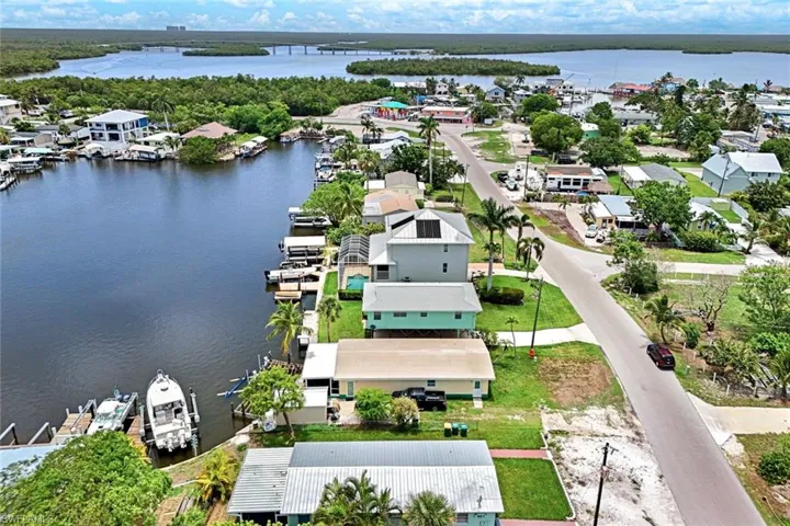 Aerial view of residential area featuring a large body of water