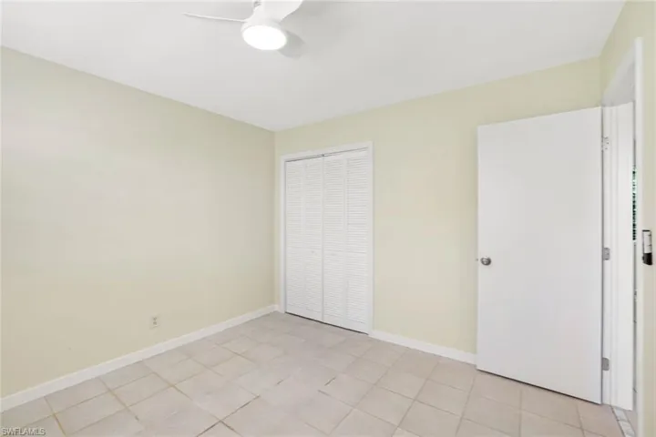 Unfurnished bedroom with a closet and ceiling fan