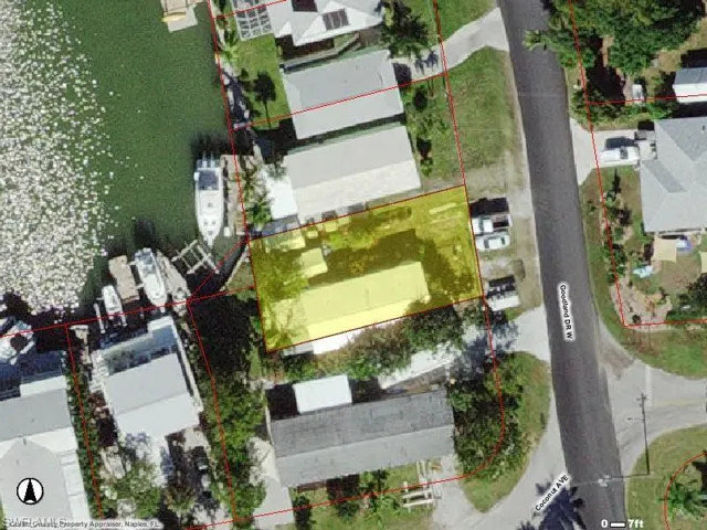 Aerial view of residential area with property boundaries highlighted