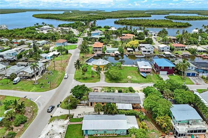Aerial perspective of suburban area with a large body of water